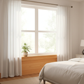 Bright bedroom with pine window stool and apron installed below double-hung window with sheer curtains